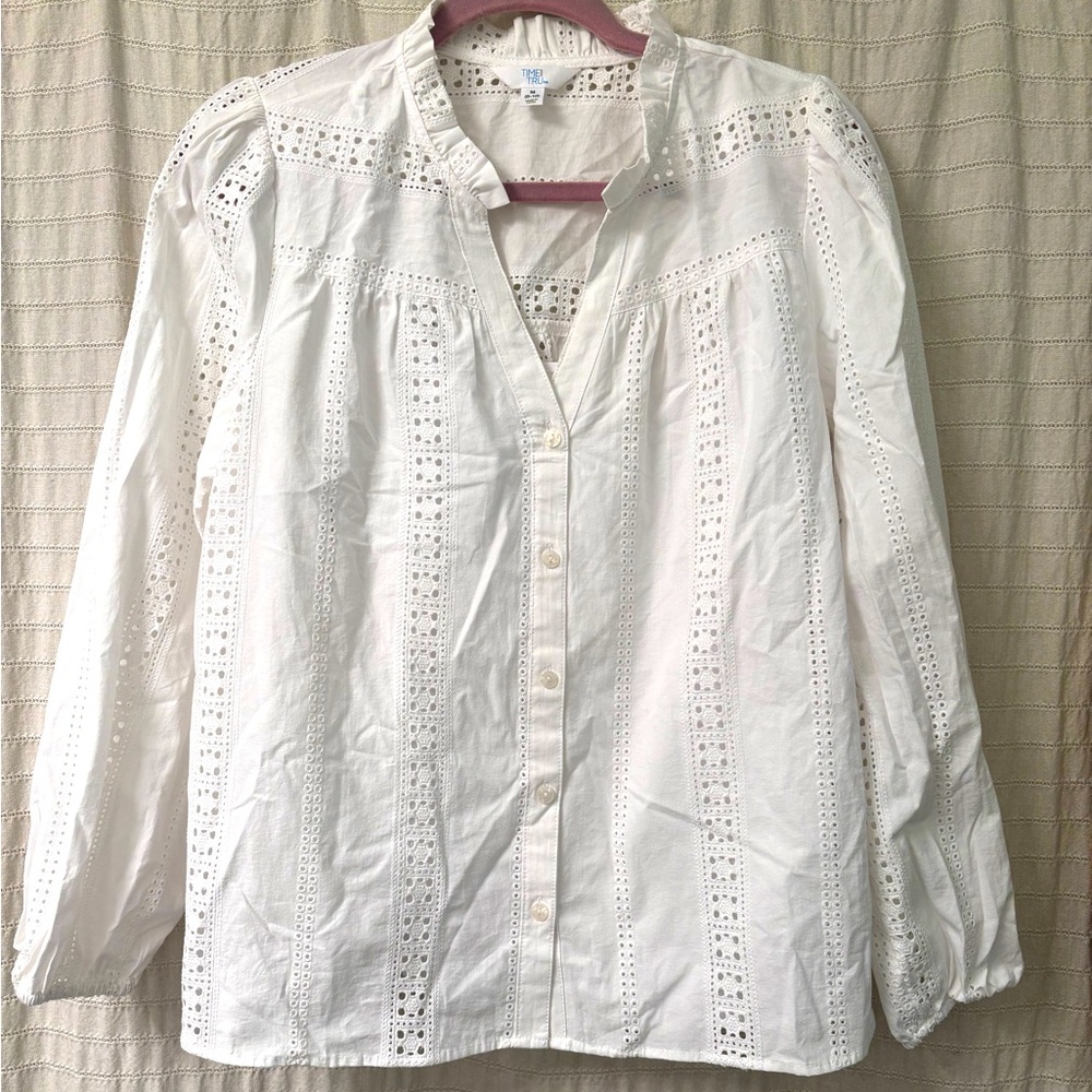 White. Linen eyelet mater shirt with buttons and cami under shirt.